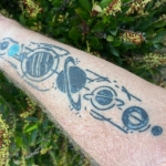 Image of tattoos showing a map; a theme in the Healthy Aging Series by Mark Neese