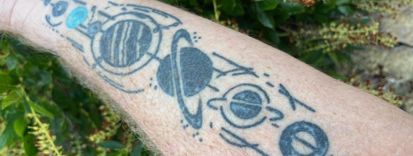Image of tattoos showing a map; a theme in the Healthy Aging Series by Mark Neese