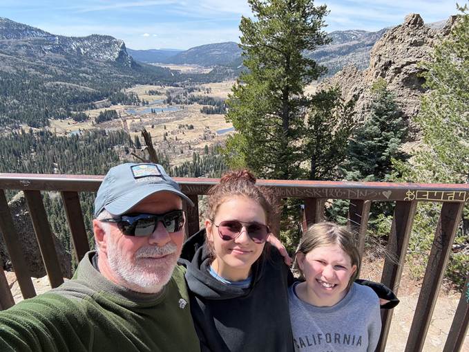Mark Neese hiking with his granddaughters. True North Counseling Blog.