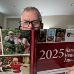 Mark Neese poses with a copy of the 2025 Harvard Health Annual for the Season 12 teaser of the Healthy Aging Series on the True North Counseling blog.